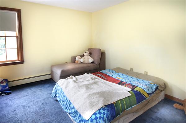 64 Cedar Street Walpole, MA 02081 - Photo 10 of 28 a bedroom with a bed and a window