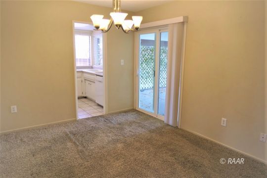 440 Debra Lane Ridgecrest, CA 93555 - Photo 15 of 32 a view of a chandelier in big room and chandelier