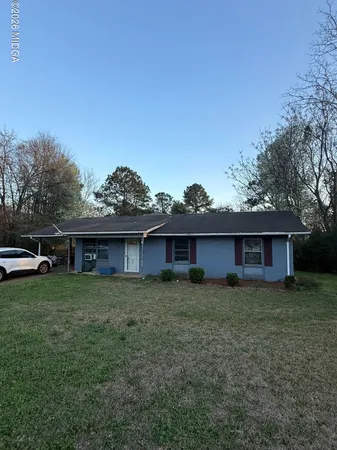 a house view with a garden space