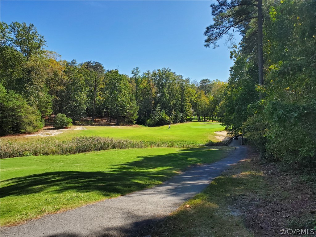 0 Steamboat Road Hartfield, VA 23071 - Photo 7 of 13 a view of a golf course with a lake