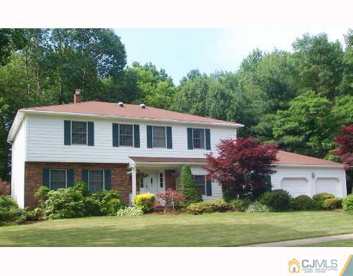 3 Fox Hill Road Edison, NJ 08820 - Photo 1 of 10 a front view of a house with a yard