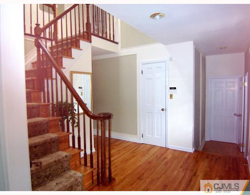 3 Fox Hill Road Edison, NJ 08820 - Photo 7 of 10 a view of entryway and hall with wooden floor