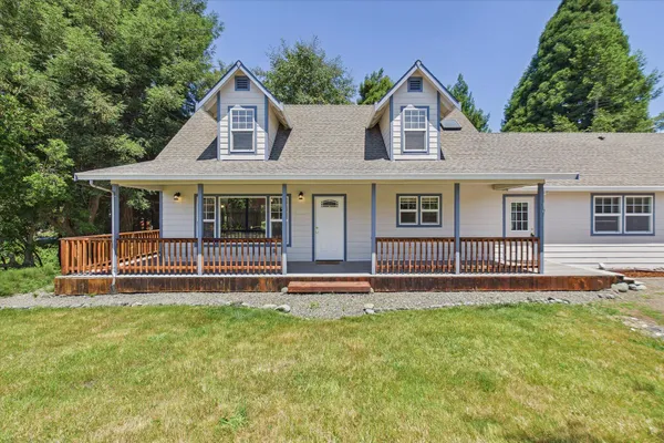 front view of a house with a yard