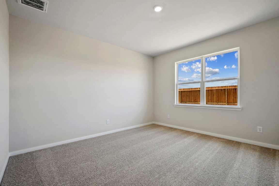10403 Red Cardinal Drive Cleveland, TX 77328 - Photo 11 of 24 an empty room with a window