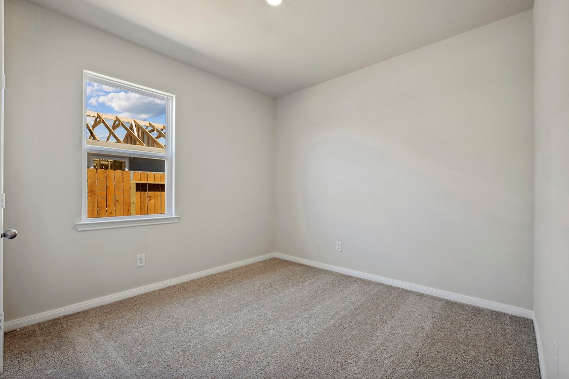 10403 Red Cardinal Drive Cleveland, TX 77328 - Photo 17 of 24 an empty room with windows