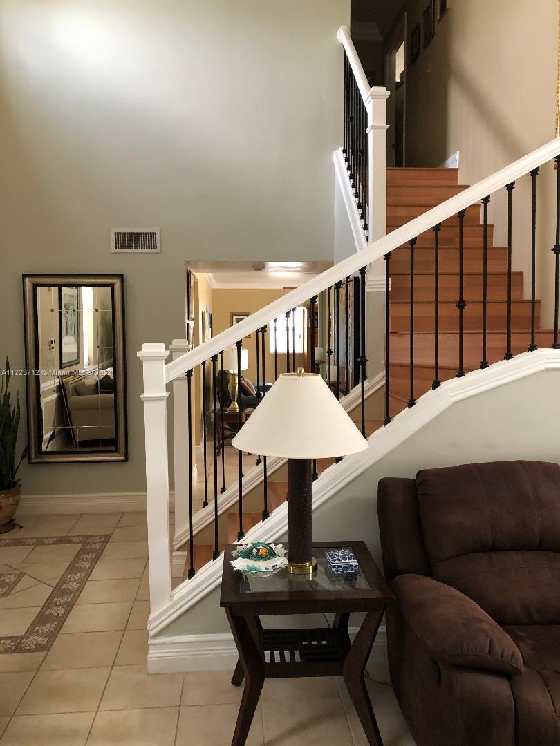 River Run Miramar, FL 33025 - Photo 12 of 23 a living room with furniture and a table