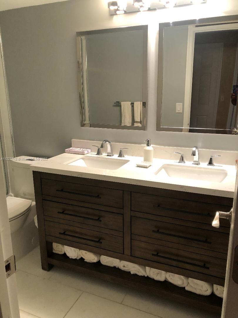 River Run Miramar, FL 33025 - Photo 16 of 23 a bathroom with a sink and a mirror