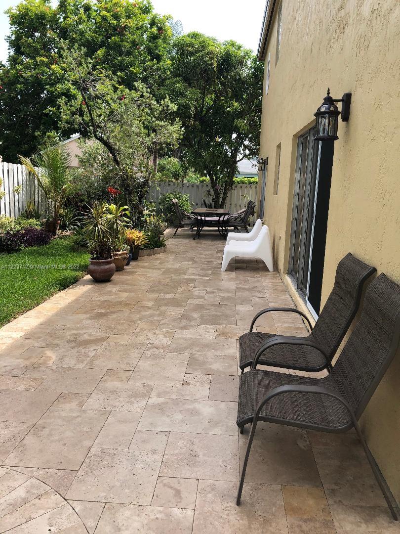 River Run Miramar, FL 33025 - Photo 20 of 23 a view of backyard with furniture and a slide