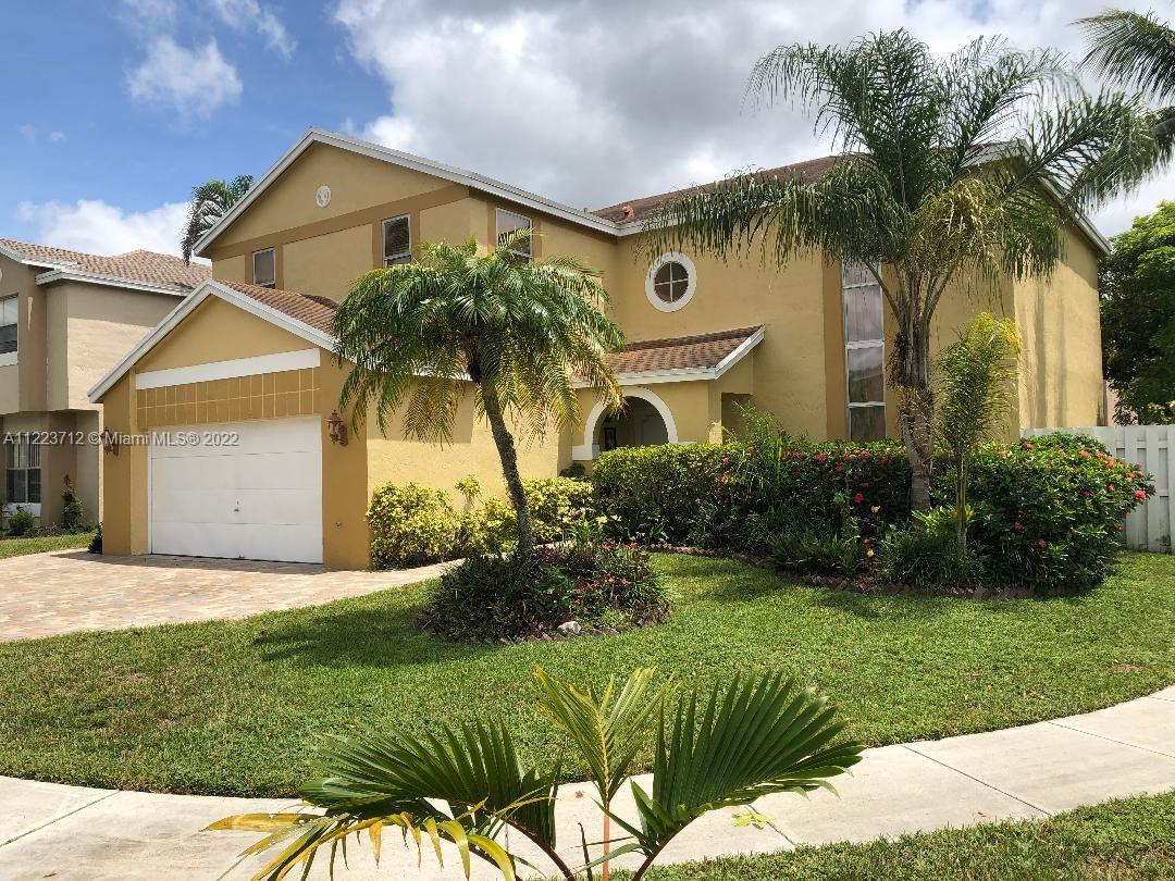 River Run Miramar, FL 33025 - Photo 3 of 23 a front view of a house with a yard