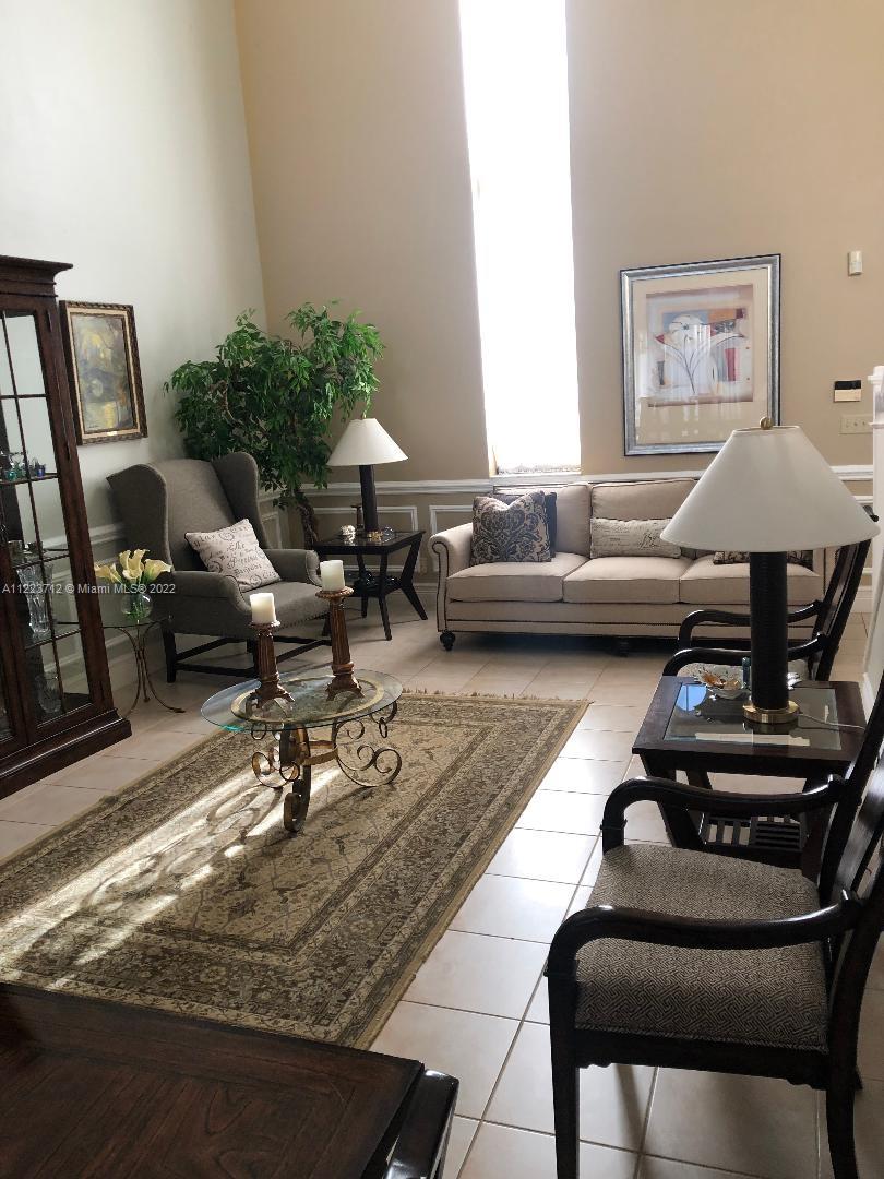 River Run Miramar, FL 33025 - Photo 6 of 23 a living room with furniture and a table