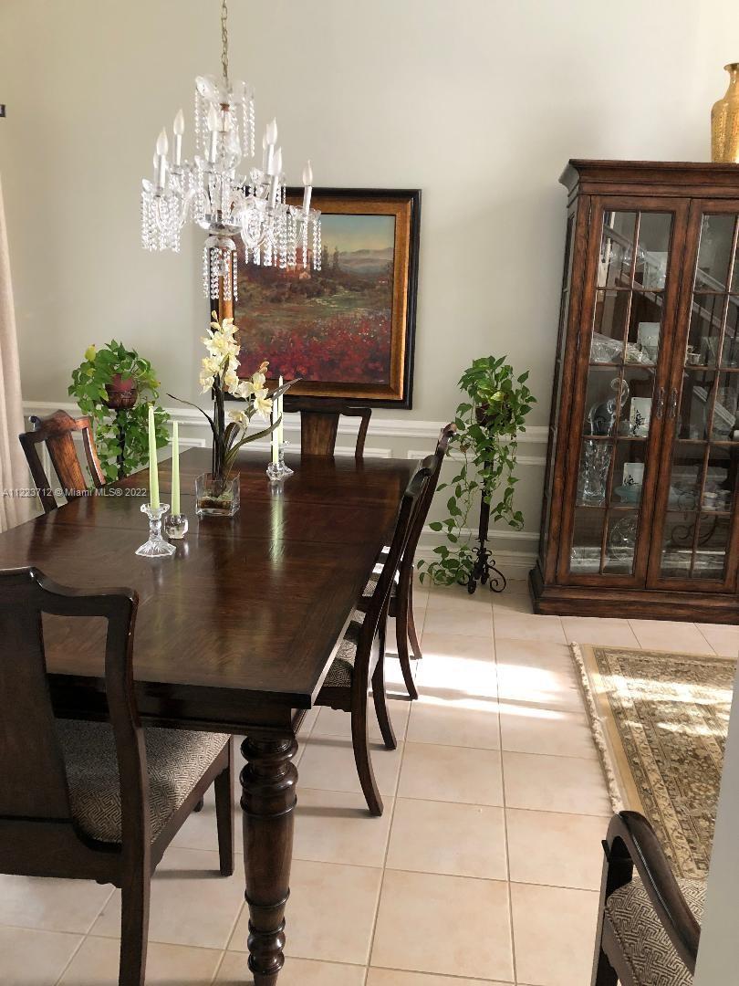 River Run Miramar, FL 33025 - Photo 7 of 23 a view of a dining room with furniture and chandelier