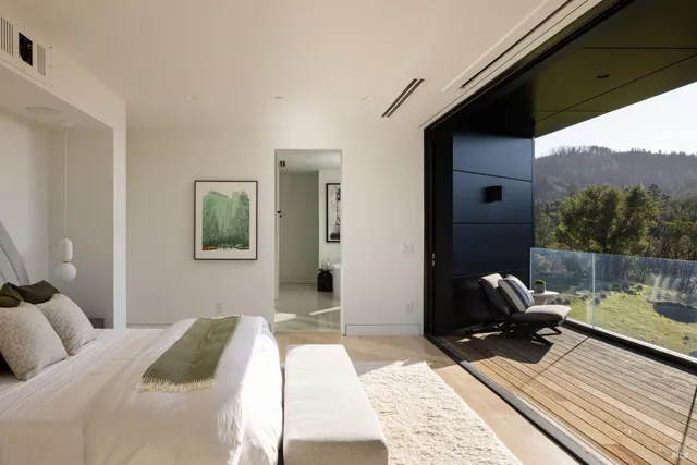 a bed room with a bed and a window