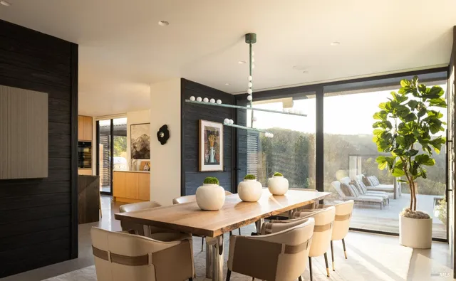 a view of a dining room with furniture window and outside view
