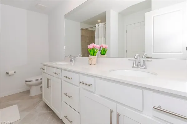 a bathroom with a shower and a glass door