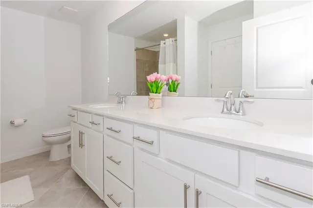 a bathroom with a shower and a glass door