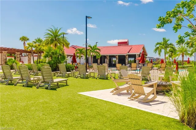 a view of a house with a yard patio and swimming pool