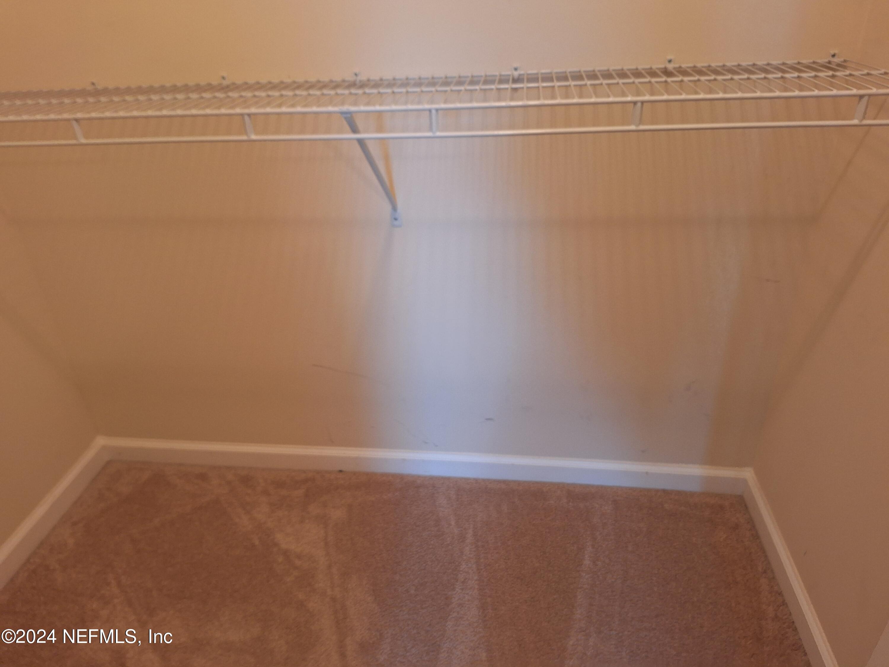 177 Richmond Drive St. Johns, FL 32259 - Photo 19 of 29 a view of a room with racks on the wall