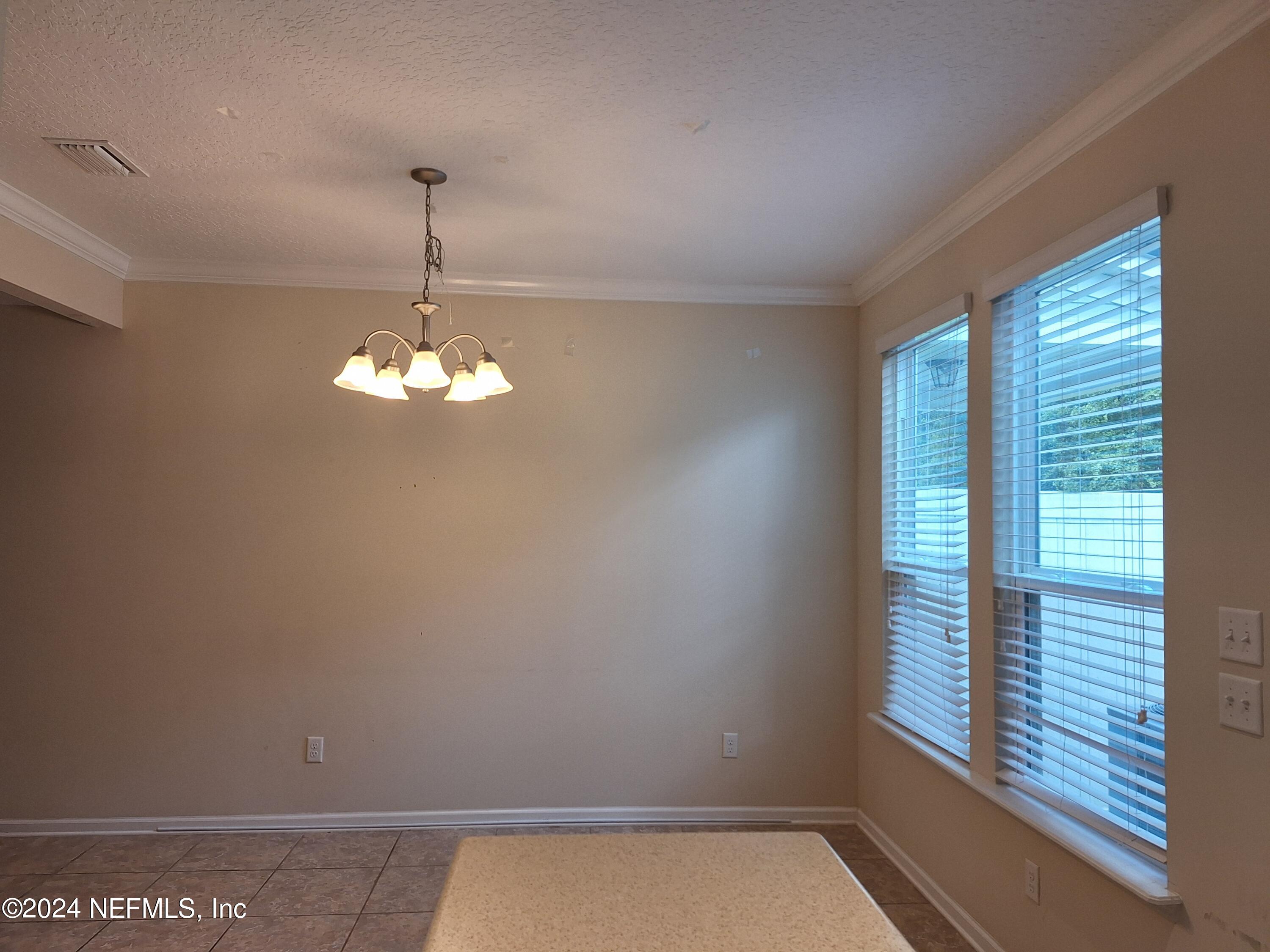 177 Richmond Drive St. Johns, FL 32259 - Photo 6 of 29 a view of a windows and chandelier in a room