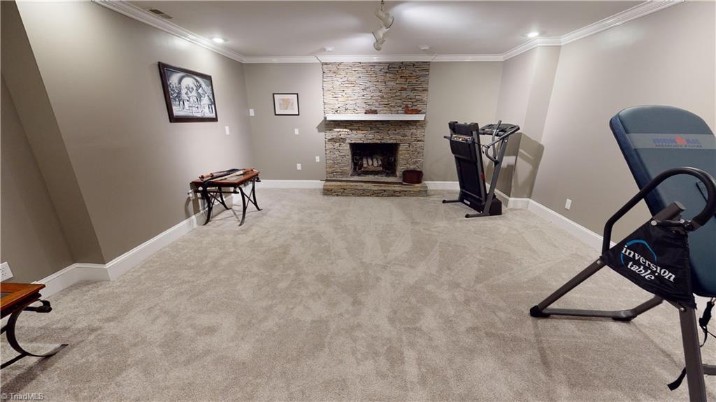 3920 Beechridge Road Winston-Salem, NC 27106 - Photo 28 of 30 Lower level den/family room has a fireplace and bar