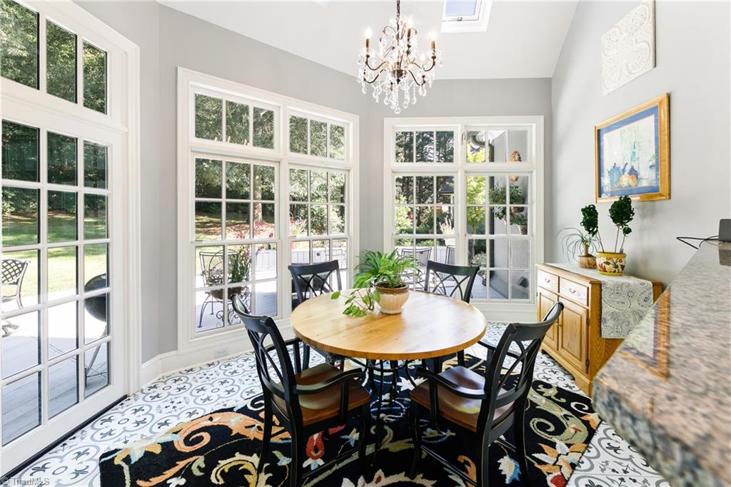 3920 Beechridge Road Winston-Salem, NC 27106 - Photo 10 of 30 Breakfast area has a new tile floor and tons of windows