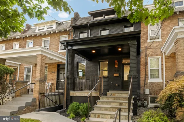 a front view of a house with a porch