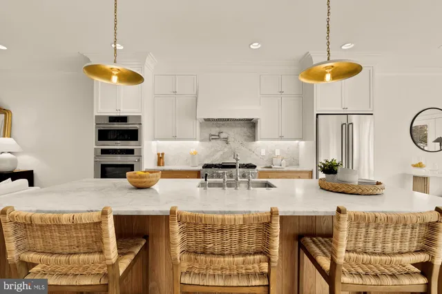 a view of a kitchen counter space a sink and appliances
