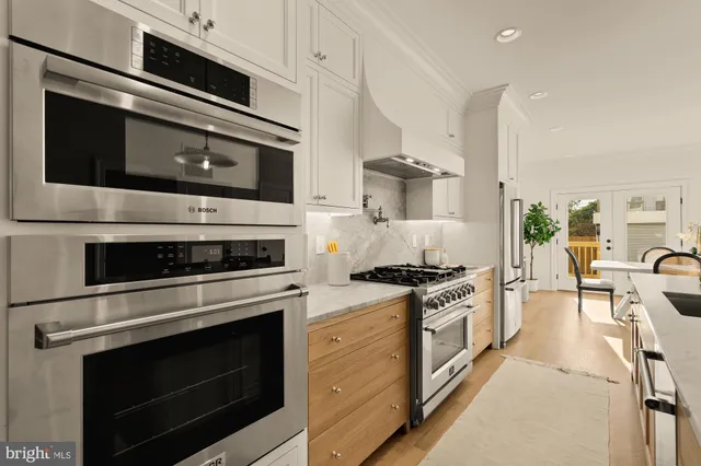 a view of a kitchen area kitchen island dining table and chairs