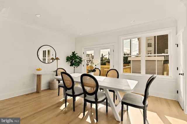 a kitchen with a stove and a wooden floor