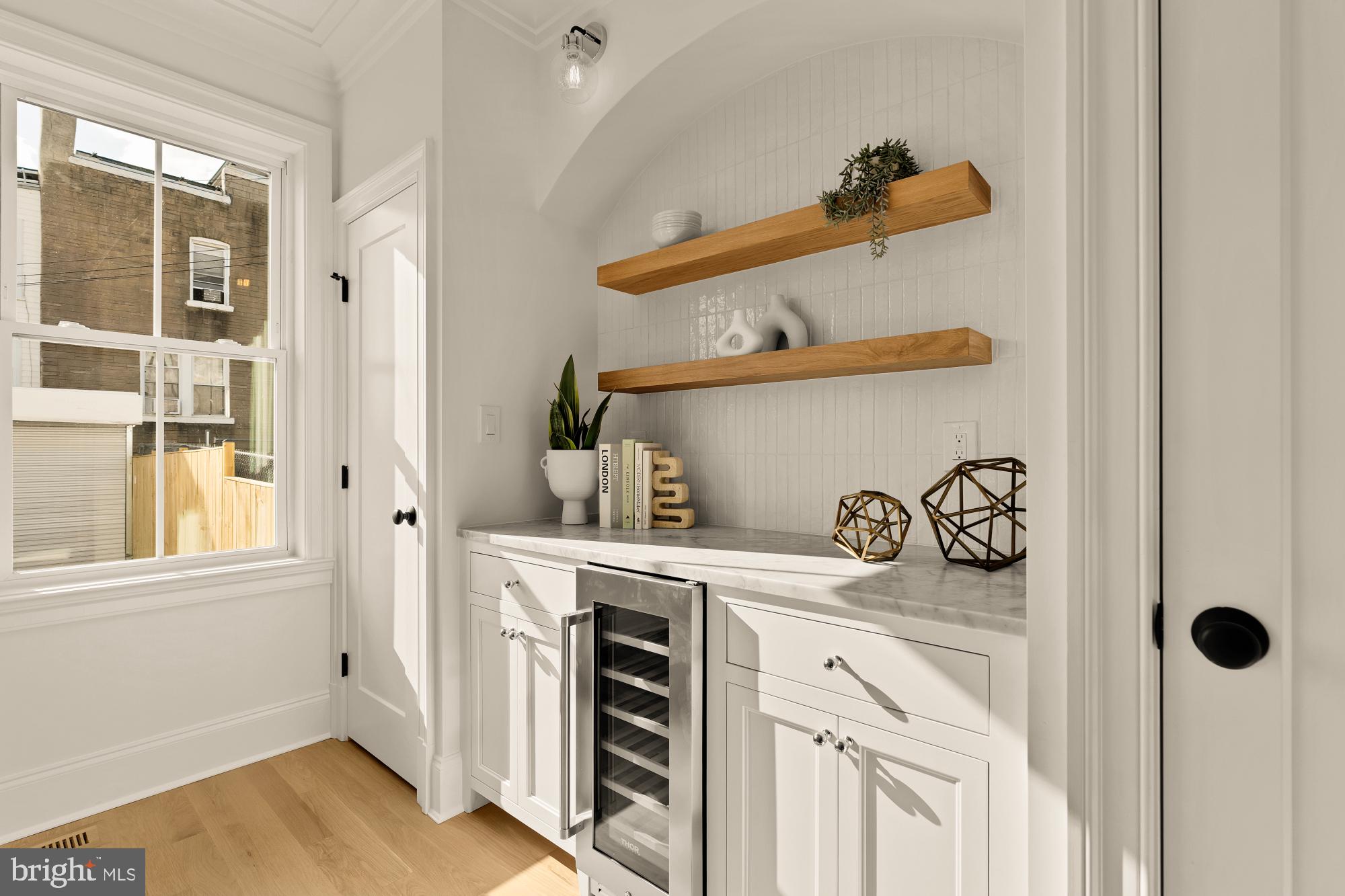 4830 8th Street Northwest Washington, DC 20011 - Photo 22 of 54 a kitchen with a stove and a wooden floor