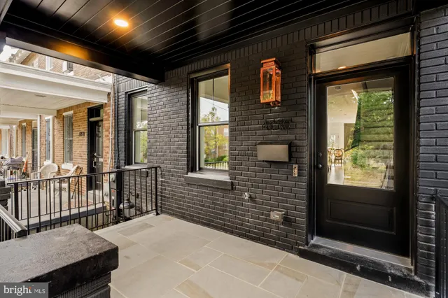 a living room with furniture and a dining table