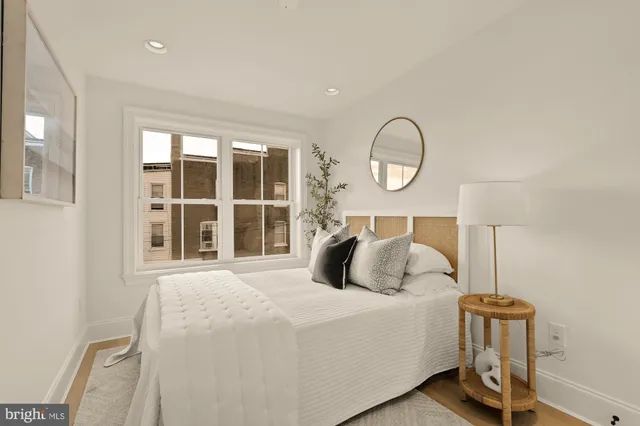 a bathroom with a toilet and a bathtub