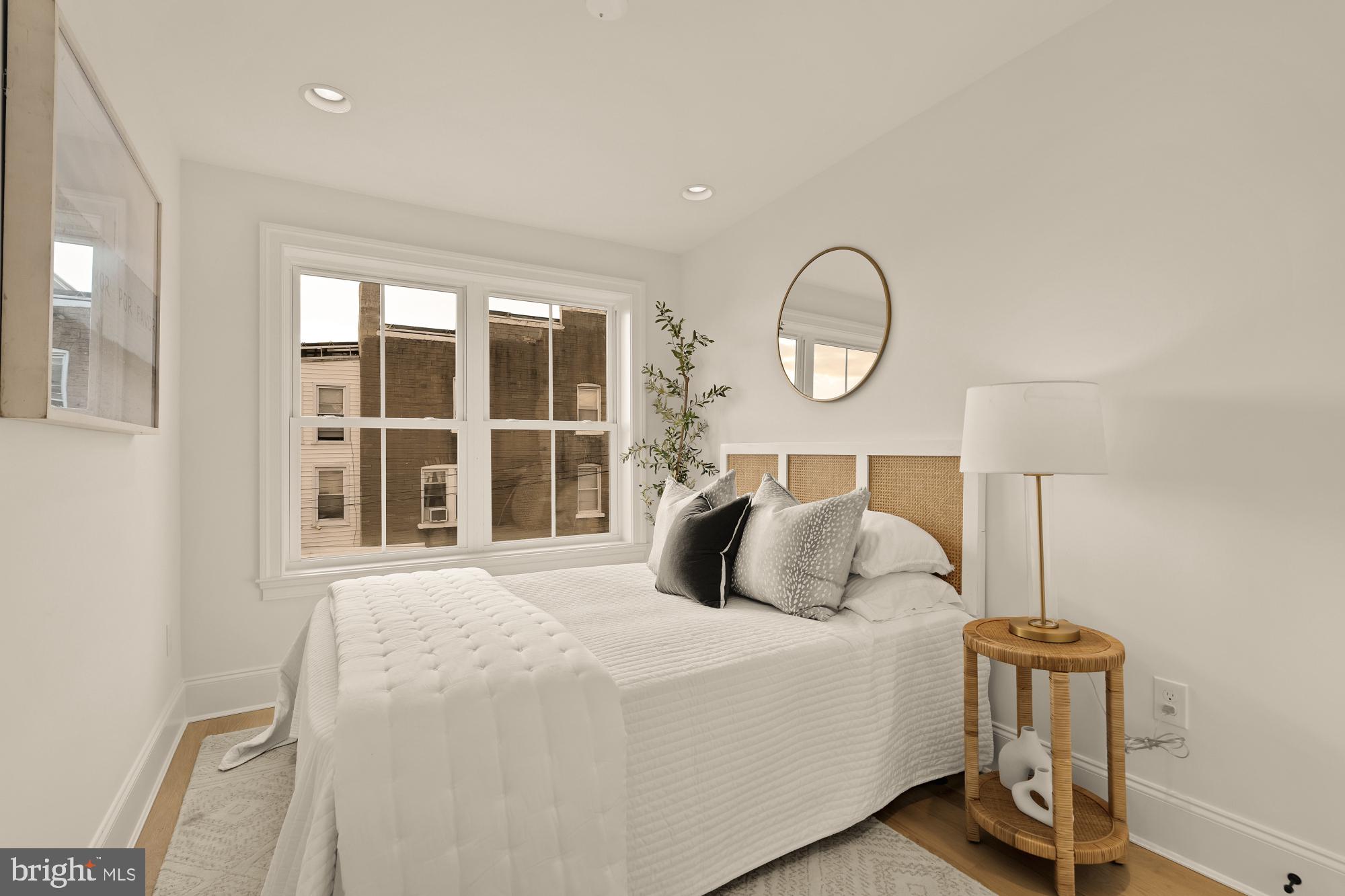 4830 8th Street Northwest Washington, DC 20011 - Photo 31 of 54 a bedroom with a bed and a window