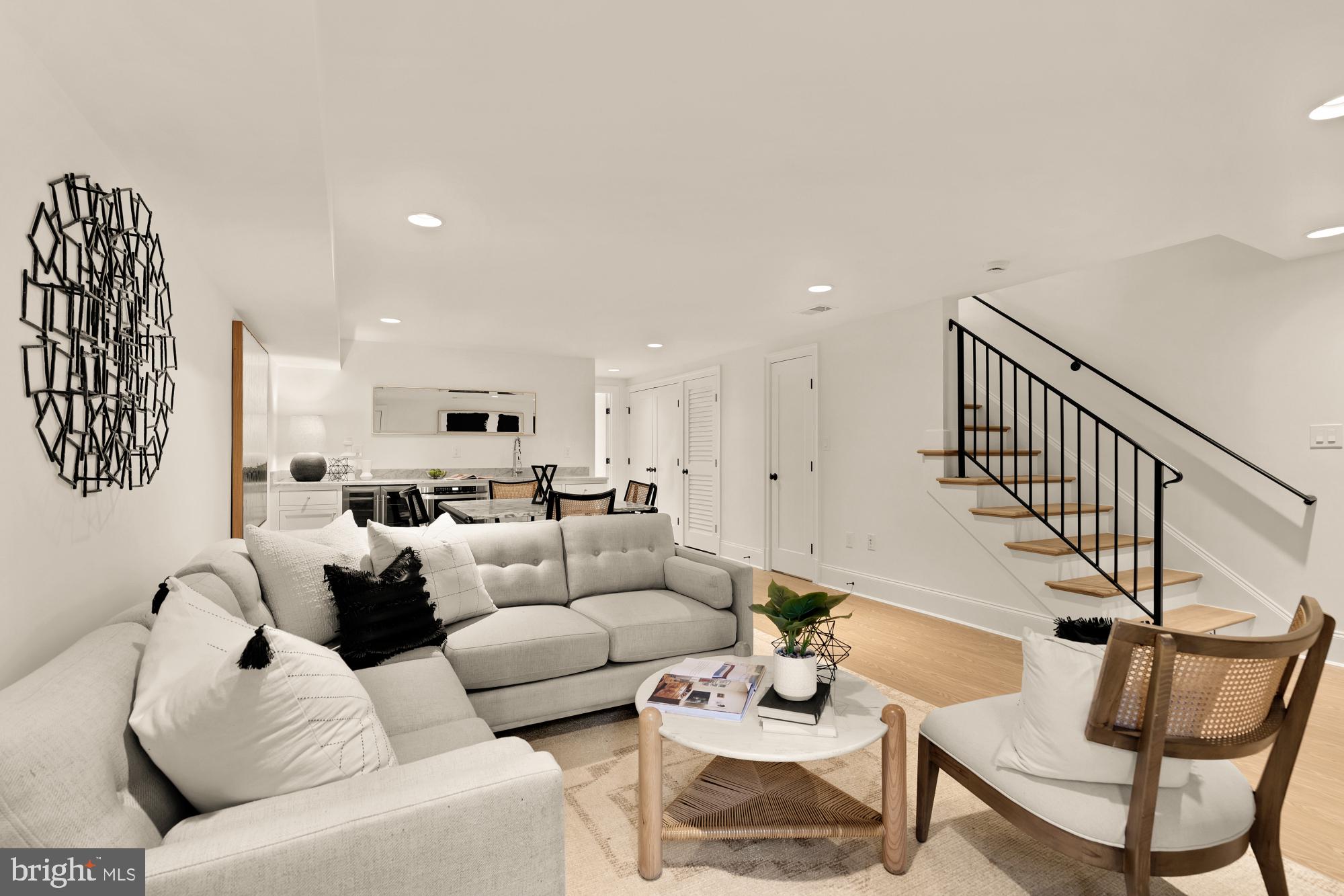 4830 8th Street Northwest Washington, DC 20011 - Photo 37 of 54 a living room with furniture kitchen view and a wooden floor