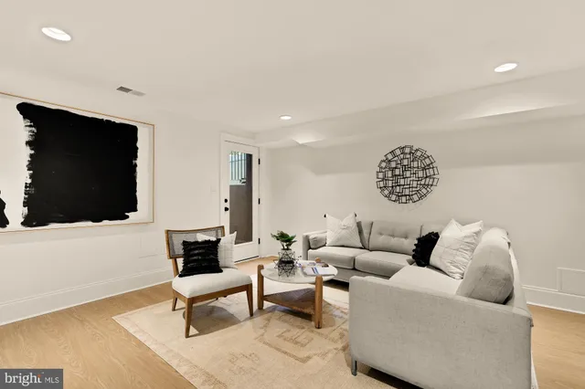 a view of a livingroom with furniture and a flat screen tv