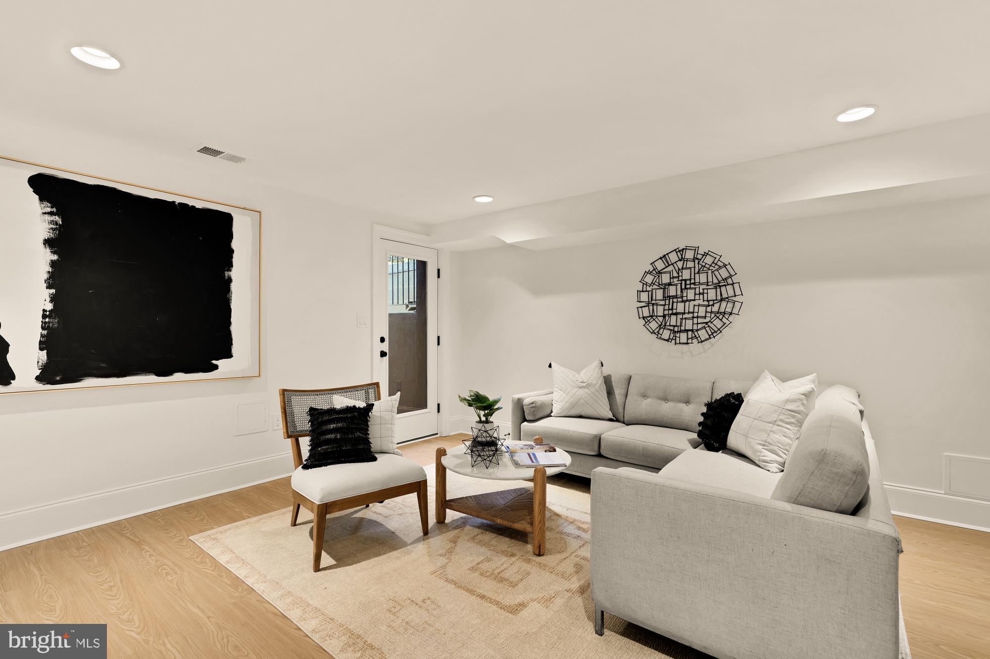 4830 8th Street Northwest Washington, DC 20011 - Photo 39 of 54 a living room with furniture and a flat screen tv