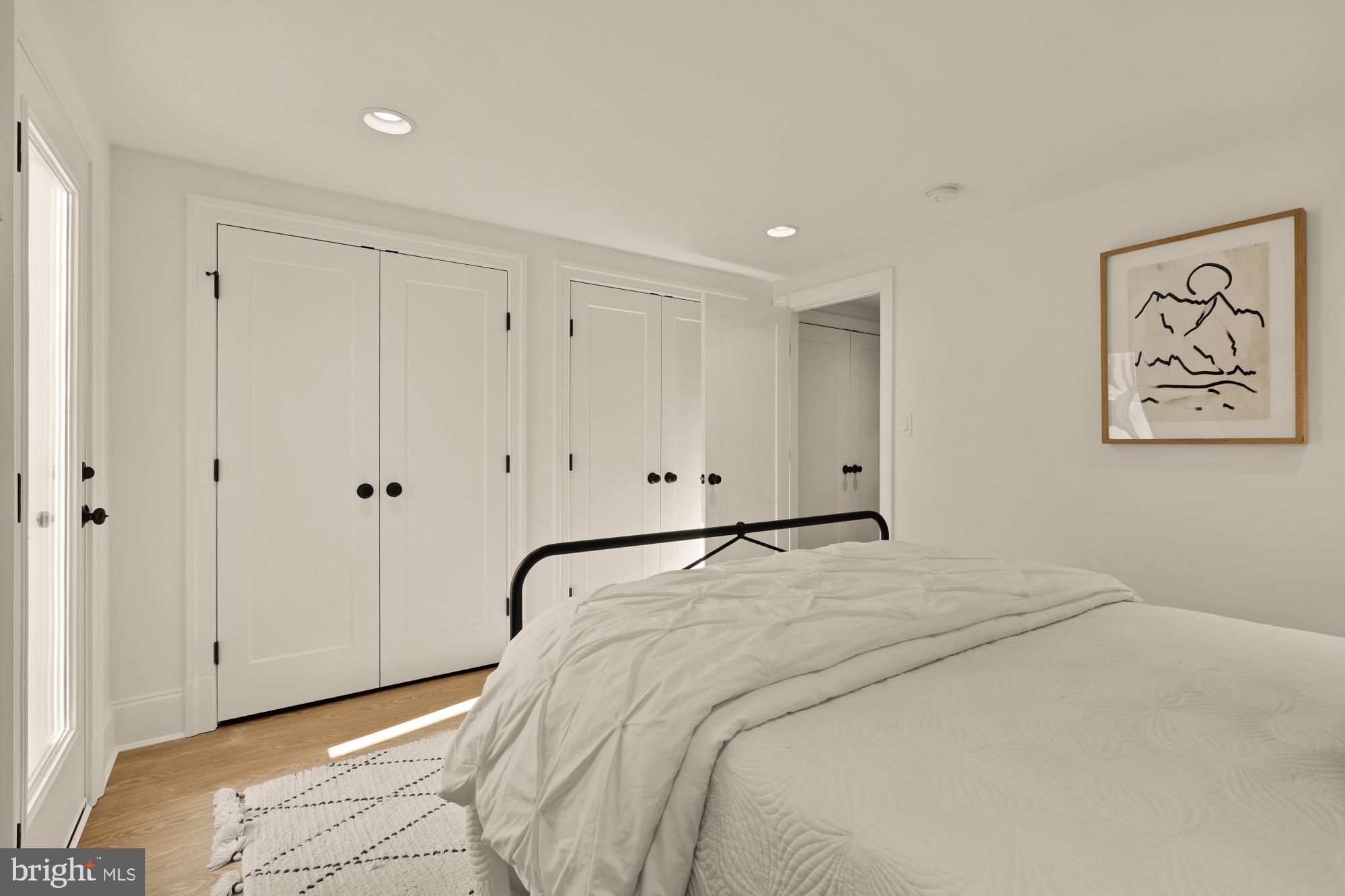 4830 8th Street Northwest Washington, DC 20011 - Photo 50 of 54 a bedroom with a bed and a painting on the wall