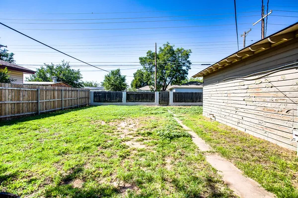 a view of a backyard with a garden