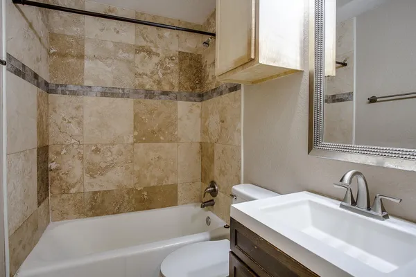 a bathroom with a sink and a bathtub