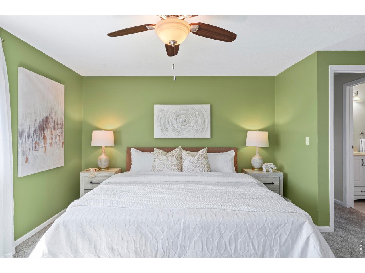 9338 Pierce Street Westminster, CO 80021 - Photo 13 of 26 a bedroom with a bed and a painting on the wall