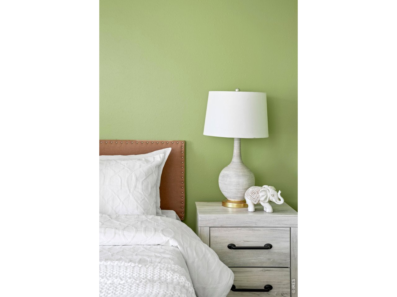 9338 Pierce Street Westminster, CO 80021 - Photo 15 of 26 a bed room with a bed and a lamp