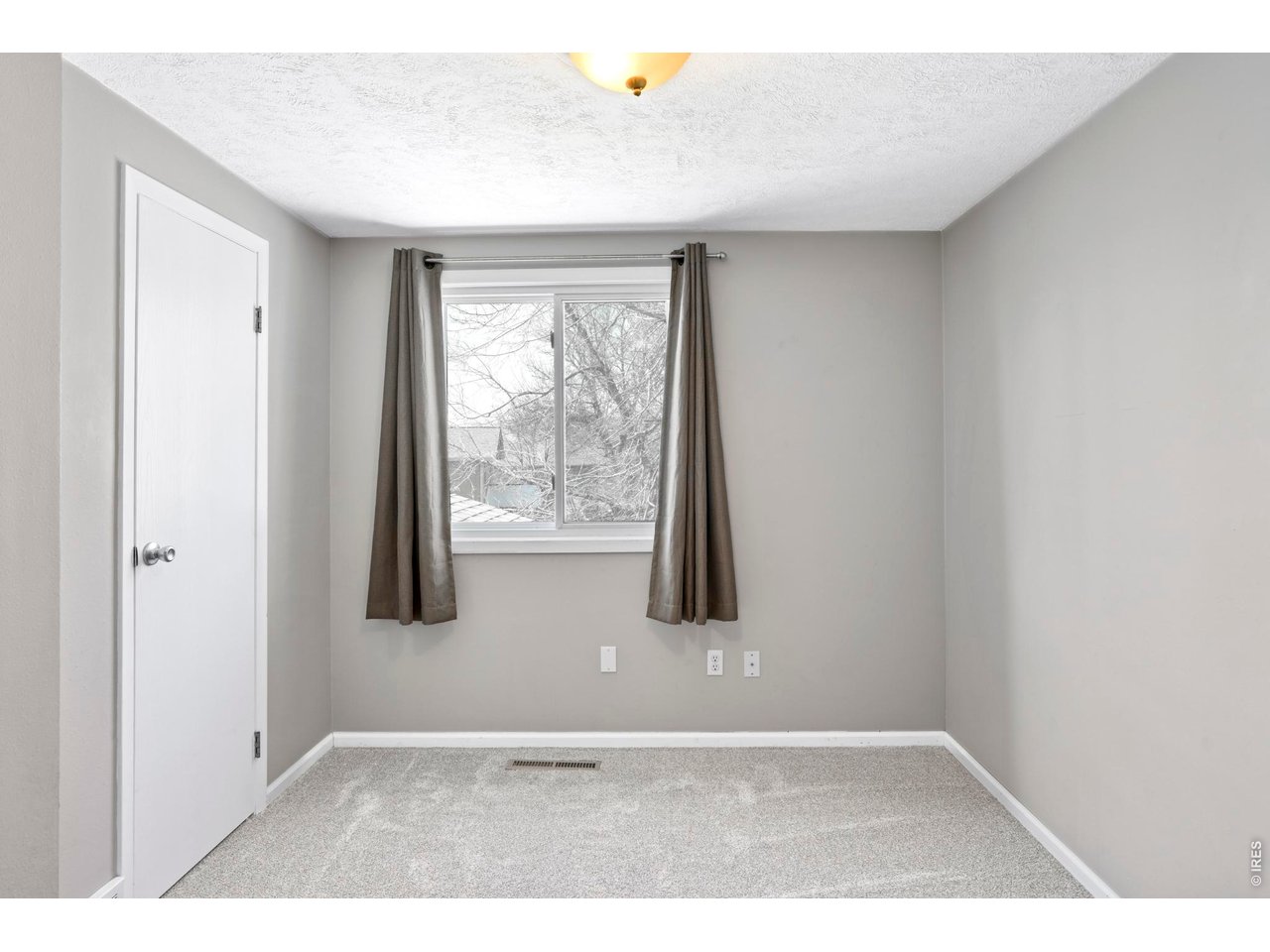 9338 Pierce Street Westminster, CO 80021 - Photo 16 of 26 a view of an empty room with a window