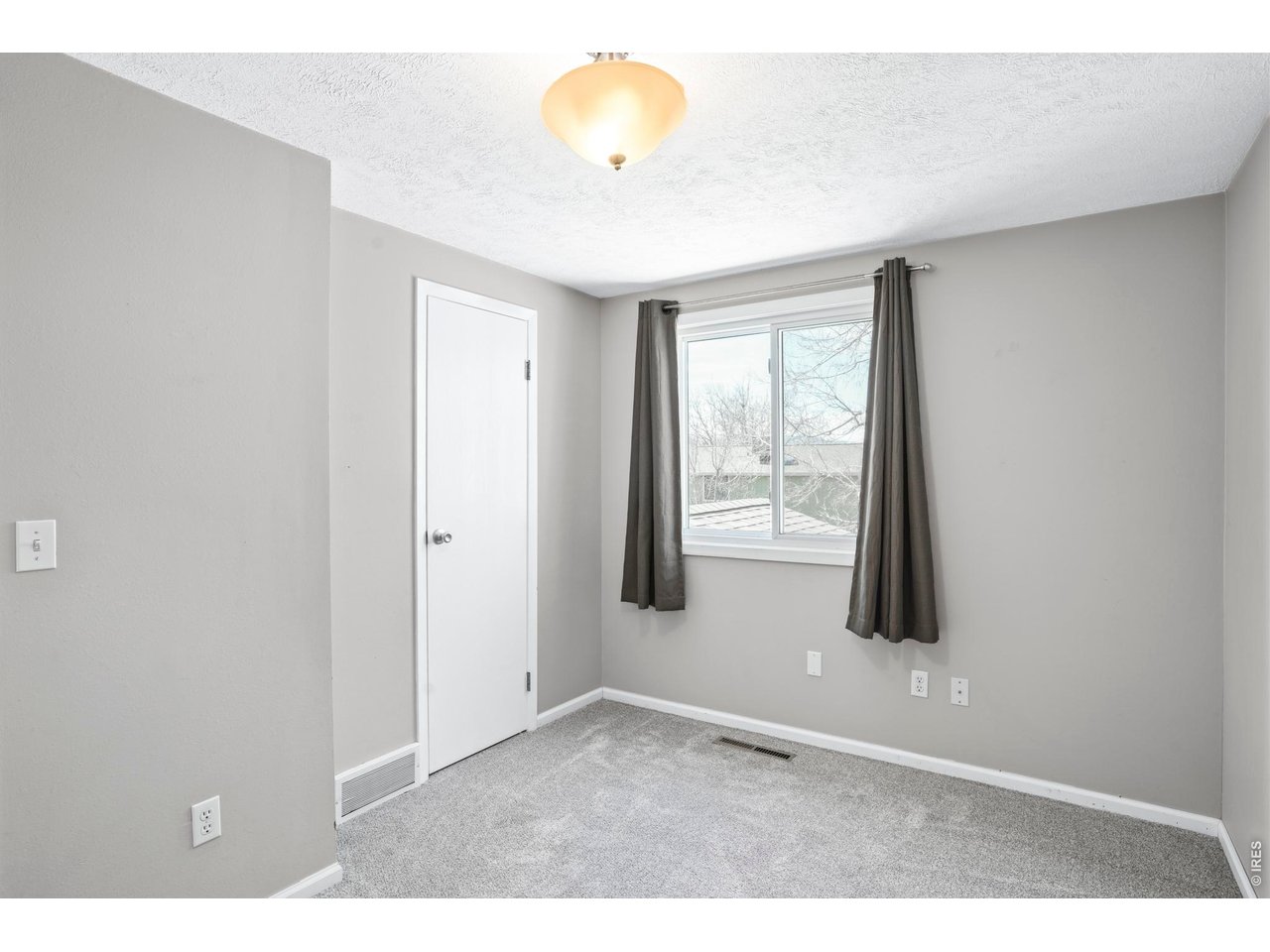 9338 Pierce Street Westminster, CO 80021 - Photo 17 of 26 a view of an empty room with a window