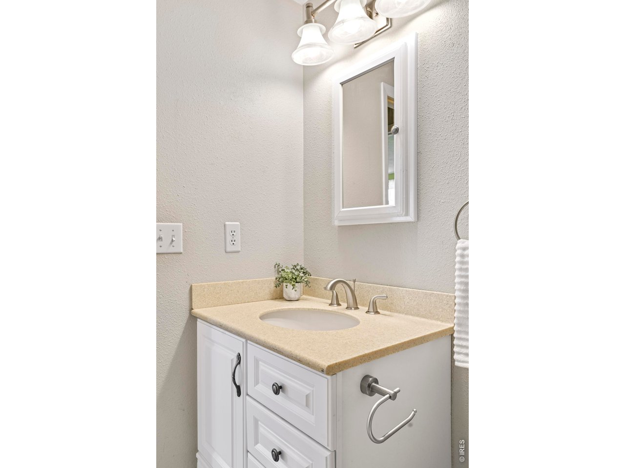 9338 Pierce Street Westminster, CO 80021 - Photo 20 of 26 a bathroom with a sink and a mirror