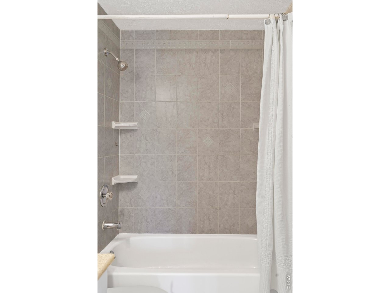 9338 Pierce Street Westminster, CO 80021 - Photo 21 of 26 a bathroom with a bathtub