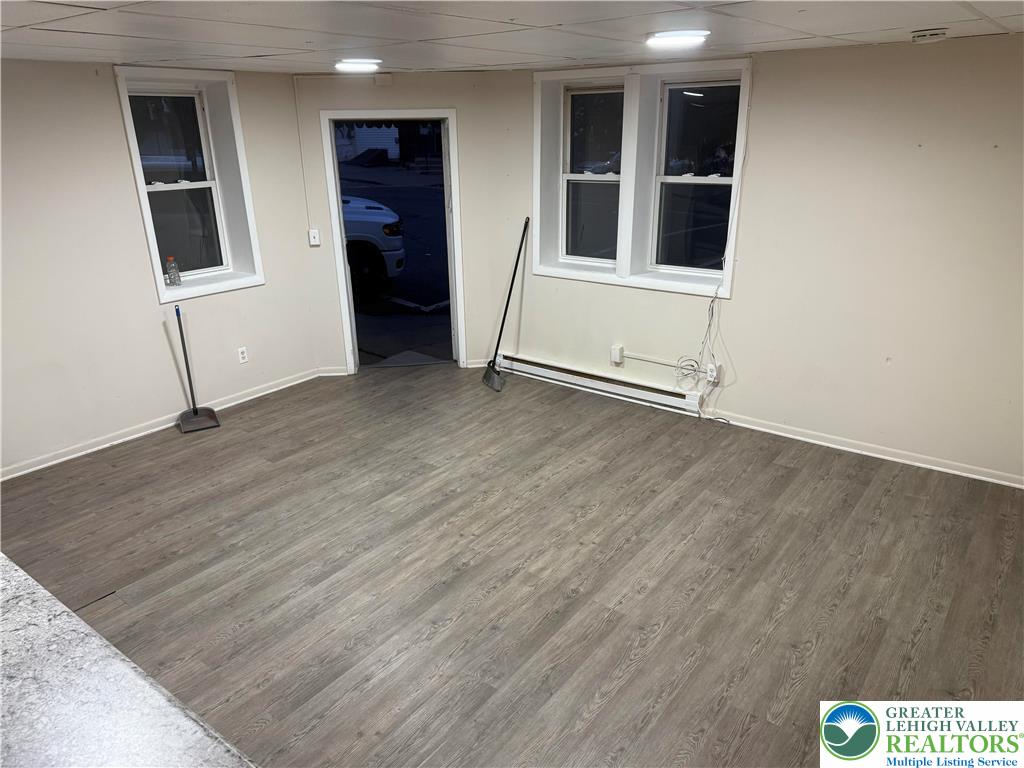 539 Atlantic Street Bethlehem, PA 18015 - Photo 2 of 12 an empty room with wooden floor and windows