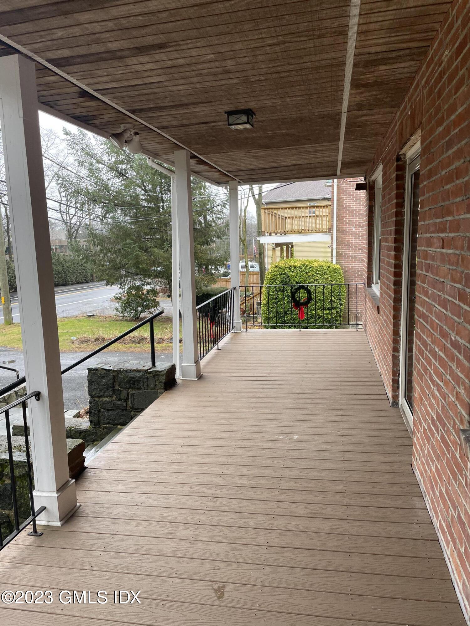 60 Weaver Street, Unit 2 Greenwich, CT 06831 - Photo 2 of 20 a view of a patio with wooden floor