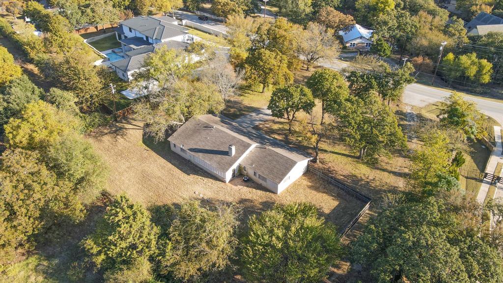 1963 East Dove Road Southlake, TX 76092 - Photo 27 of 27 a view of a yard with plants and large trees