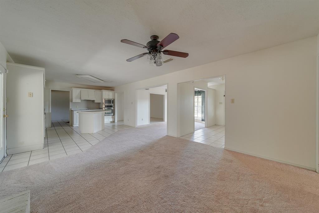 1963 East Dove Road Southlake, TX 76092 - Photo 6 of 27 a view of a kitchen with a sink and a refrigerator