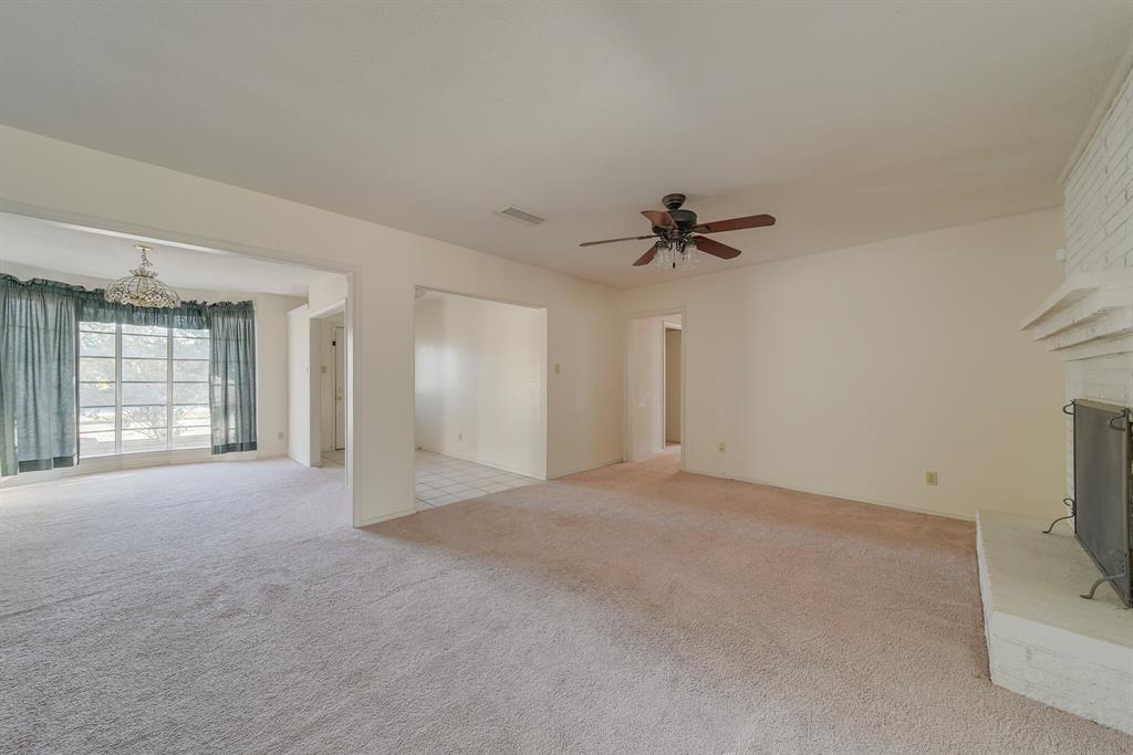 1963 East Dove Road Southlake, TX 76092 - Photo 7 of 27 a view of a livingroom with a ceiling fan and window