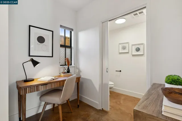 a workspace with furniture and mirror